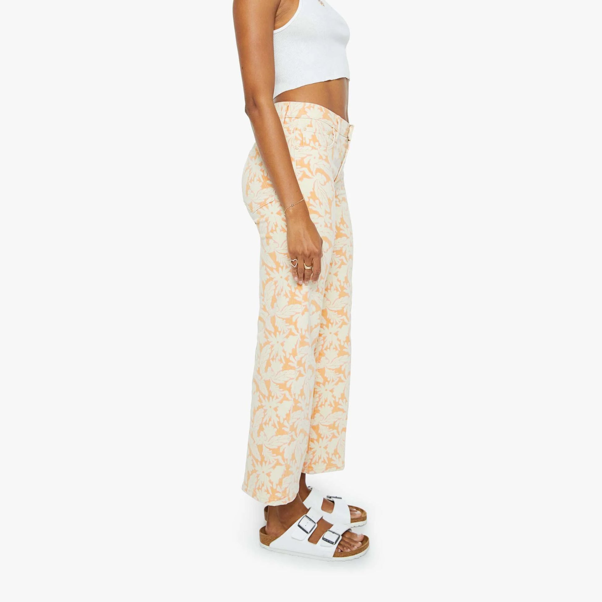 Side view of mid rise Rambler zip pants in coral reef, featuring wide straight leg and clean ankle-length design.