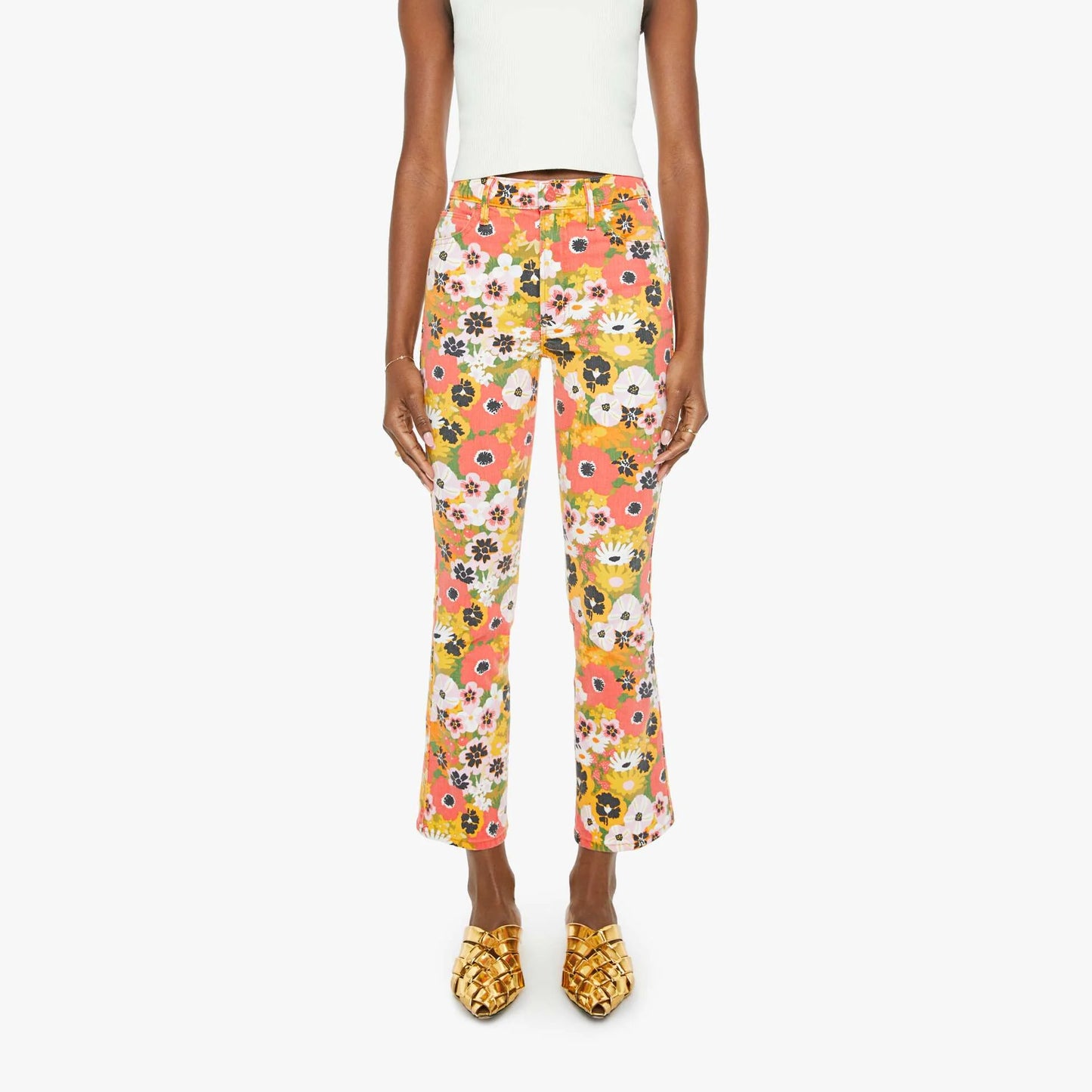 Mid-rise flared jeans in vibrant floral print, model showcasing stylish Al Fresco look, made in Los Angeles.