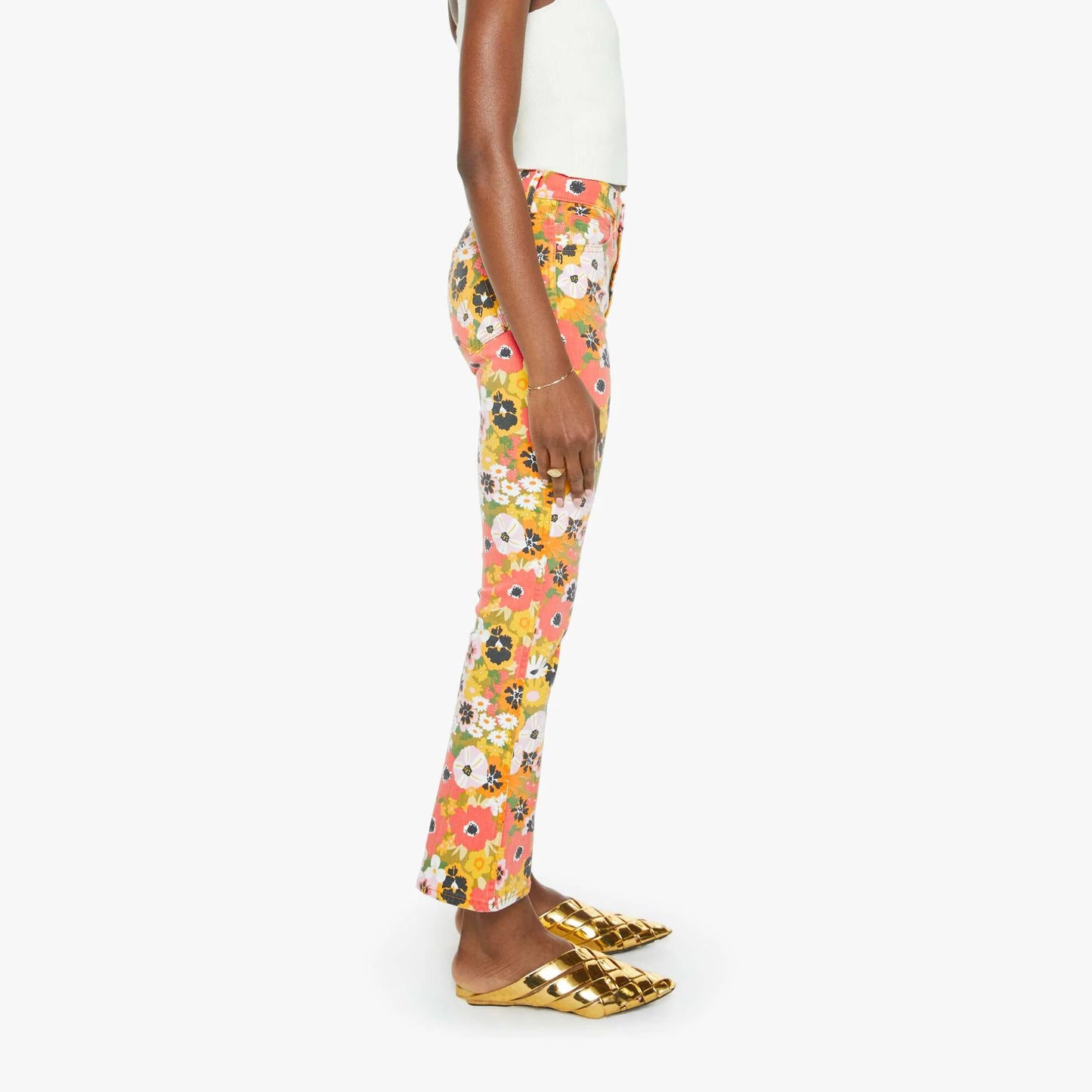 Model wearing Mid Rise Smokin' Double Flood jeans in floral print, showcasing flared leg design and stylish footwear.