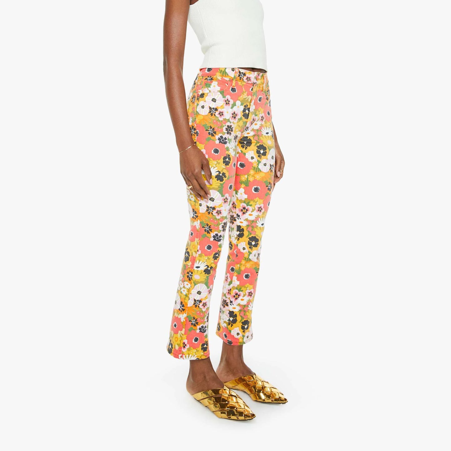 Model wearing Mid Rise Smokin' Double Flood jeans in floral print, featuring a flared leg and vibrant colors.