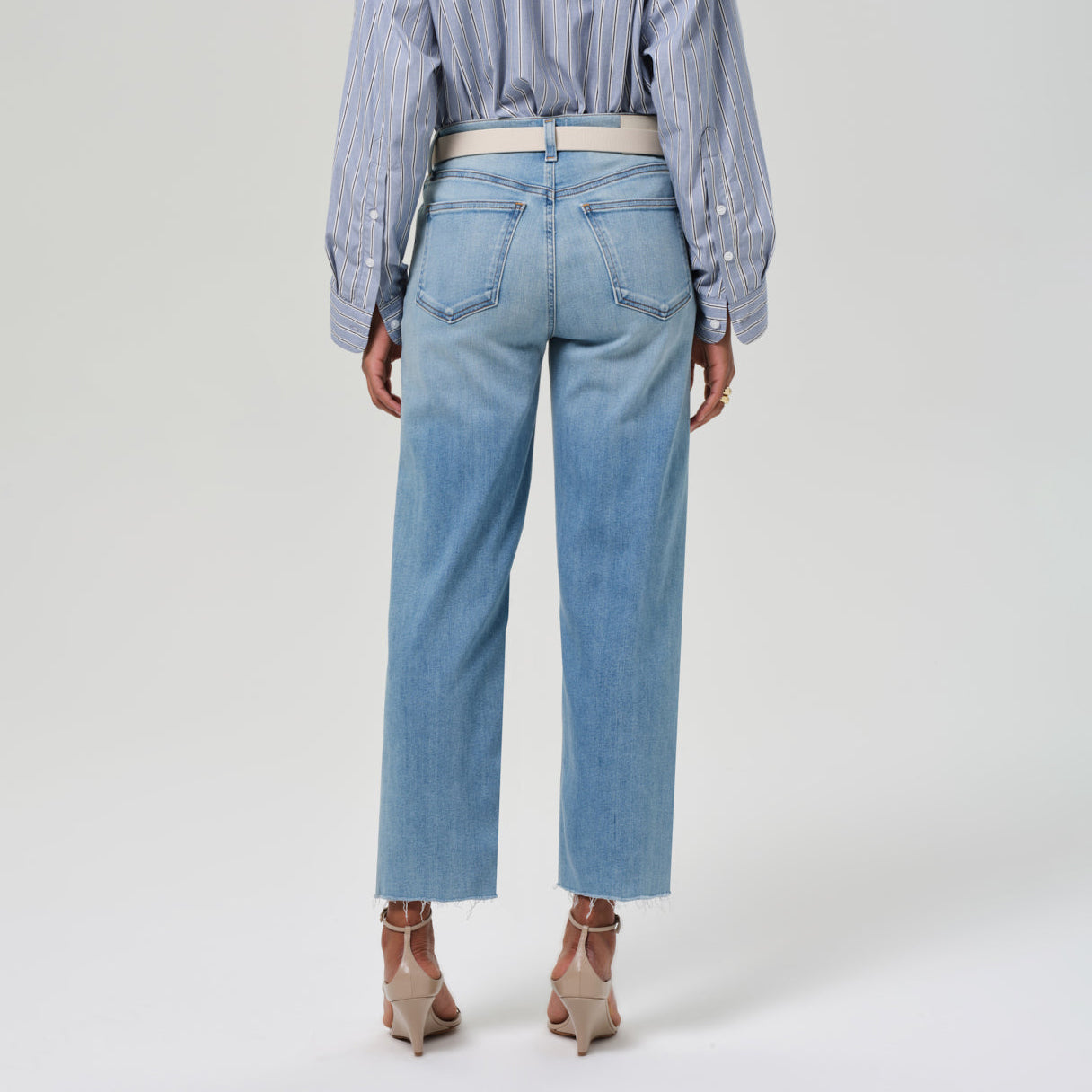 Palma Straight Leg jeans in Lisbon. High-rise silhouette with cropped length, unfinished hem, and soft stretch denim.