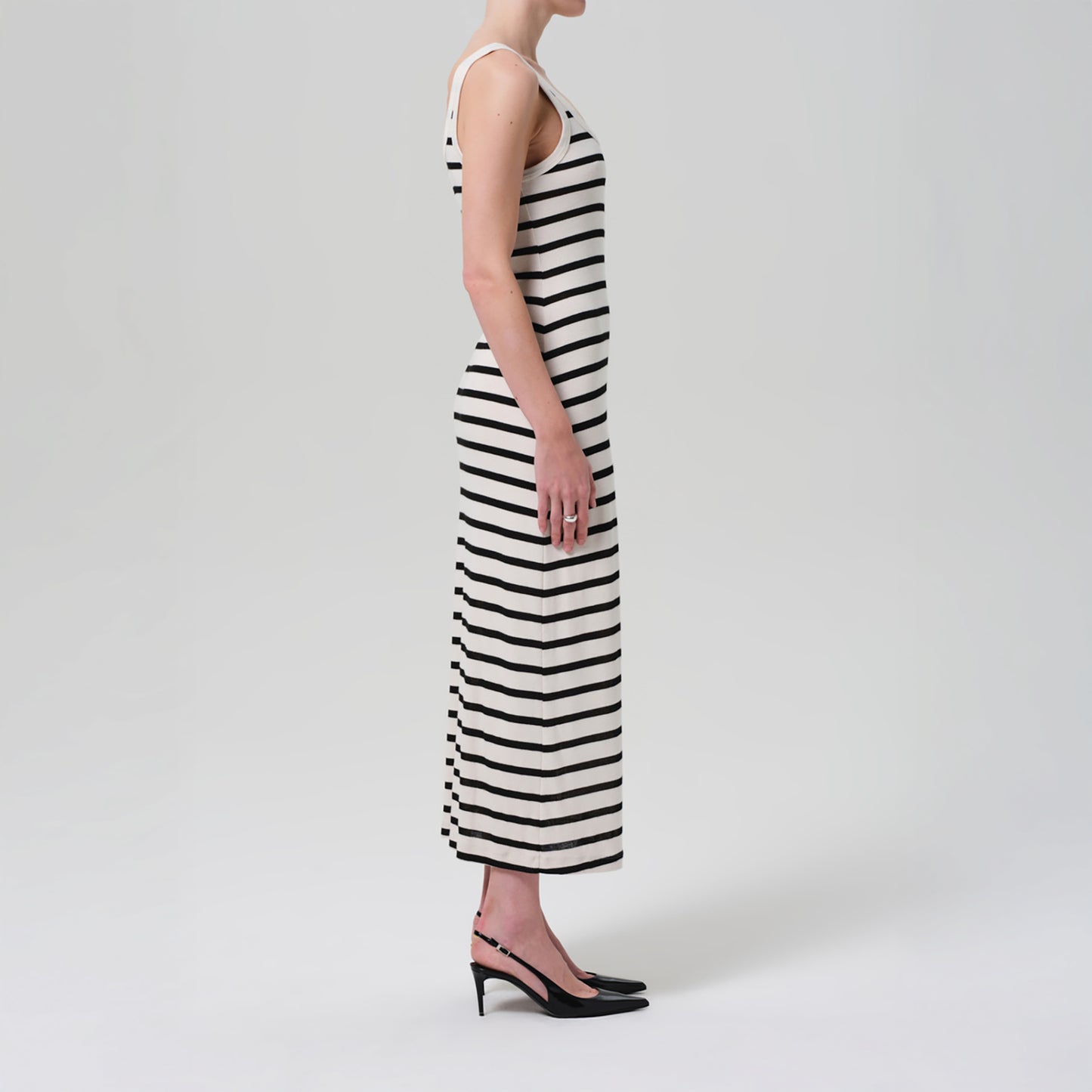 Side view of the Faye Tank Dress in Midnight Stripe featuring navy and cream stripes, scoop neck, and a slim fit.