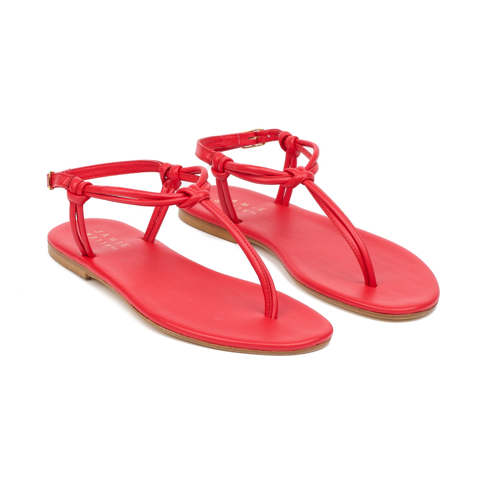 The Knot Sandal in Red featuring minimalist knotted T-strap design crafted from Italian calfskin leather.