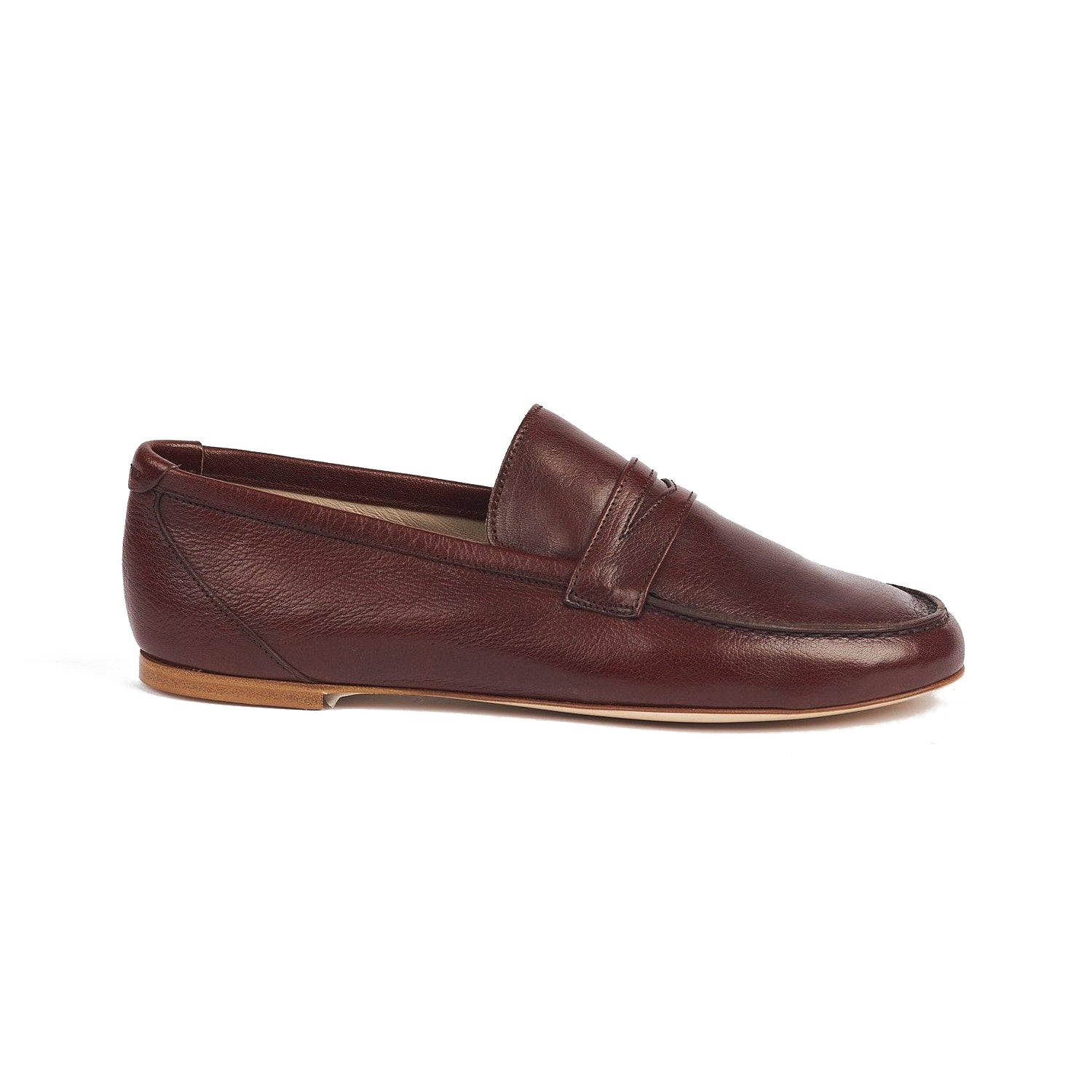 Penny loafer in oxblood leather with hand-waxed buffalo exterior, leather lining and sole, handcrafted in Italy.