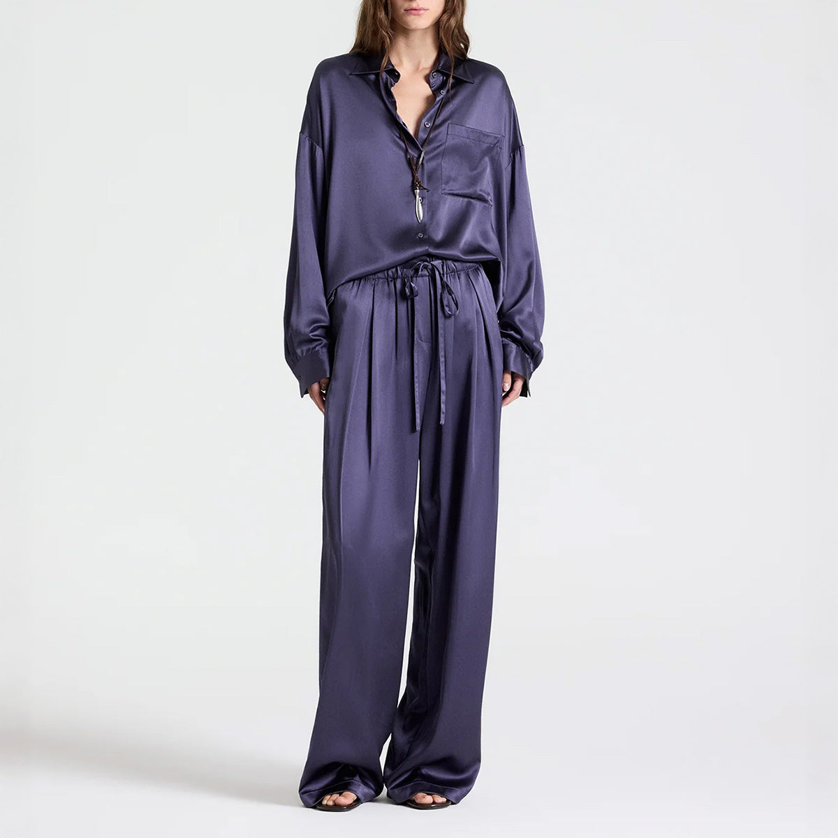 Model wearing PJ Pant in Graystone, wide-leg silk pants with drawstring and pockets.