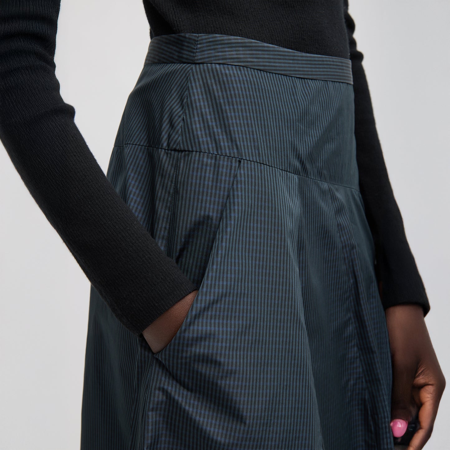 FUNDAMENTAL asymmetrical skirt in a menswear suiting-inspired plaid. Single pocket, mid-rise and invisible side zipper. Japanese compact nylon: 83% polyester, 17% polyamide Length: 31.25" (size 6) Waist: 30.5" (size 6) It is intended to sit just below the