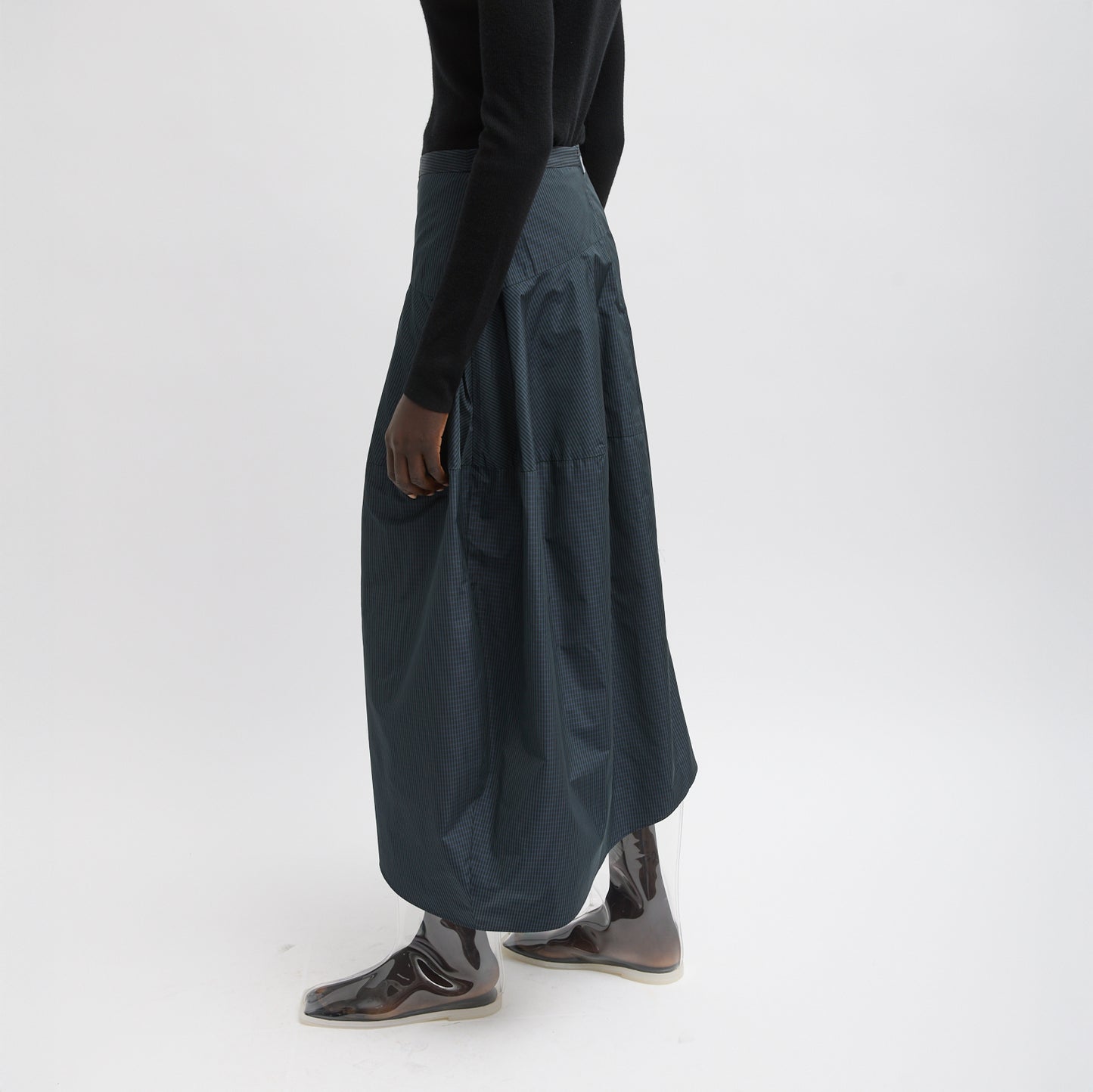 FUNDAMENTAL asymmetrical skirt in a menswear suiting-inspired plaid. Single pocket, mid-rise and invisible side zipper. Japanese compact nylon: 83% polyester, 17% polyamide Length: 31.25" (size 6) Waist: 30.5" (size 6) It is intended to sit just below the