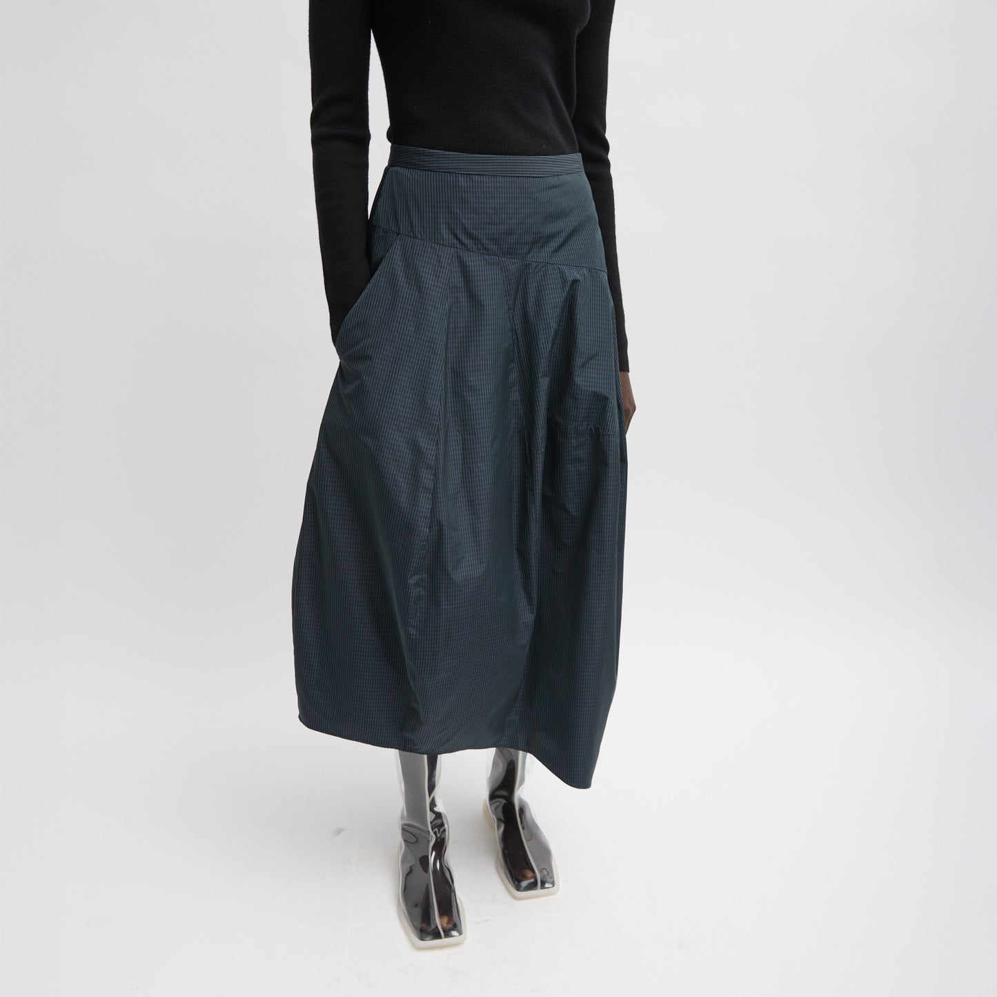 FUNDAMENTAL asymmetrical skirt in a menswear suiting-inspired plaid. Single pocket, mid-rise and invisible side zipper. Japanese compact nylon: 83% polyester, 17% polyamide Length: 31.25" (size 6) Waist: 30.5" (size 6) It is intended to sit just below the