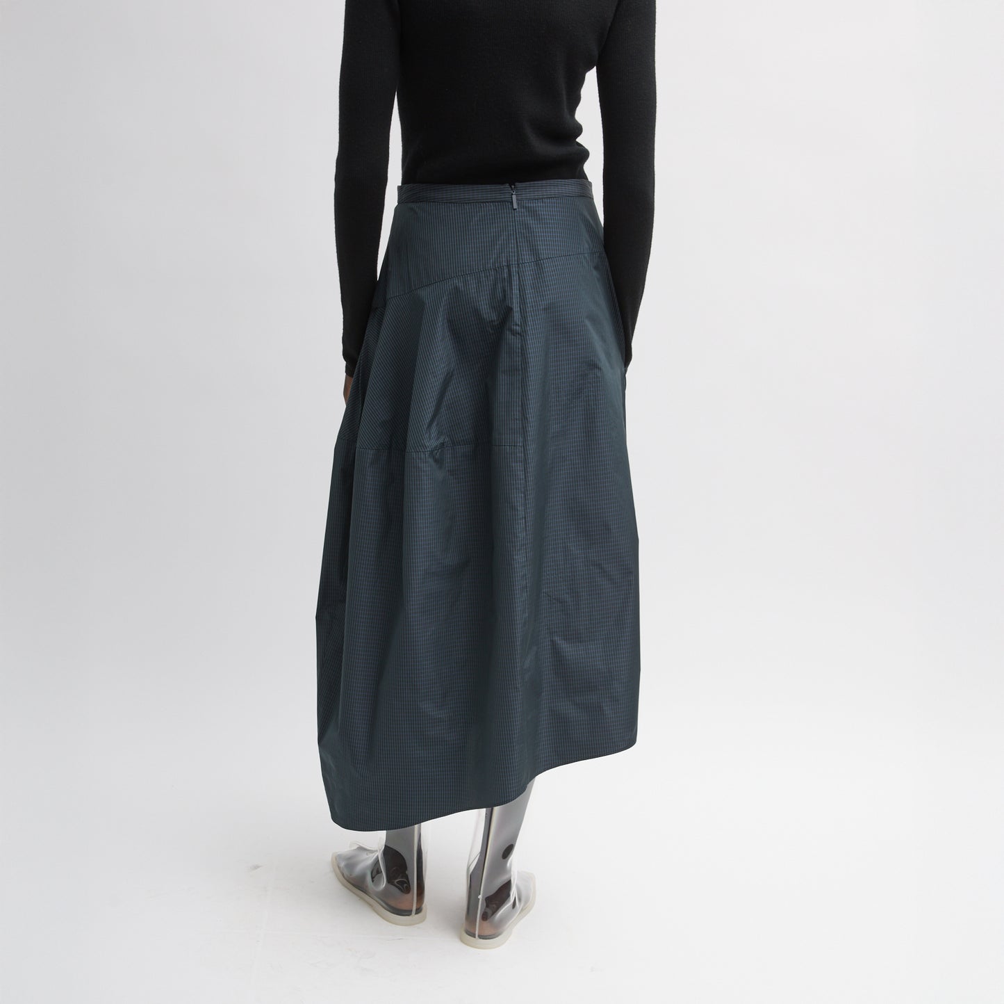 FUNDAMENTAL asymmetrical skirt in a menswear suiting-inspired plaid. Single pocket, mid-rise and invisible side zipper. Japanese compact nylon: 83% polyester, 17% polyamide Length: 31.25" (size 6) Waist: 30.5" (size 6) It is intended to sit just below the