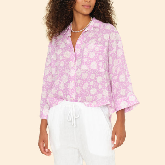 Warren Blouse in Orchid Pink, button-up with wide sleeves, left chest pocket, and shirttail hem made of 100% cotton.