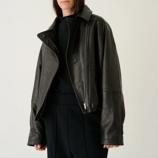The Crop Cloud in Black, a soft supple bubble coat with zip closure and oversized fit in leather.