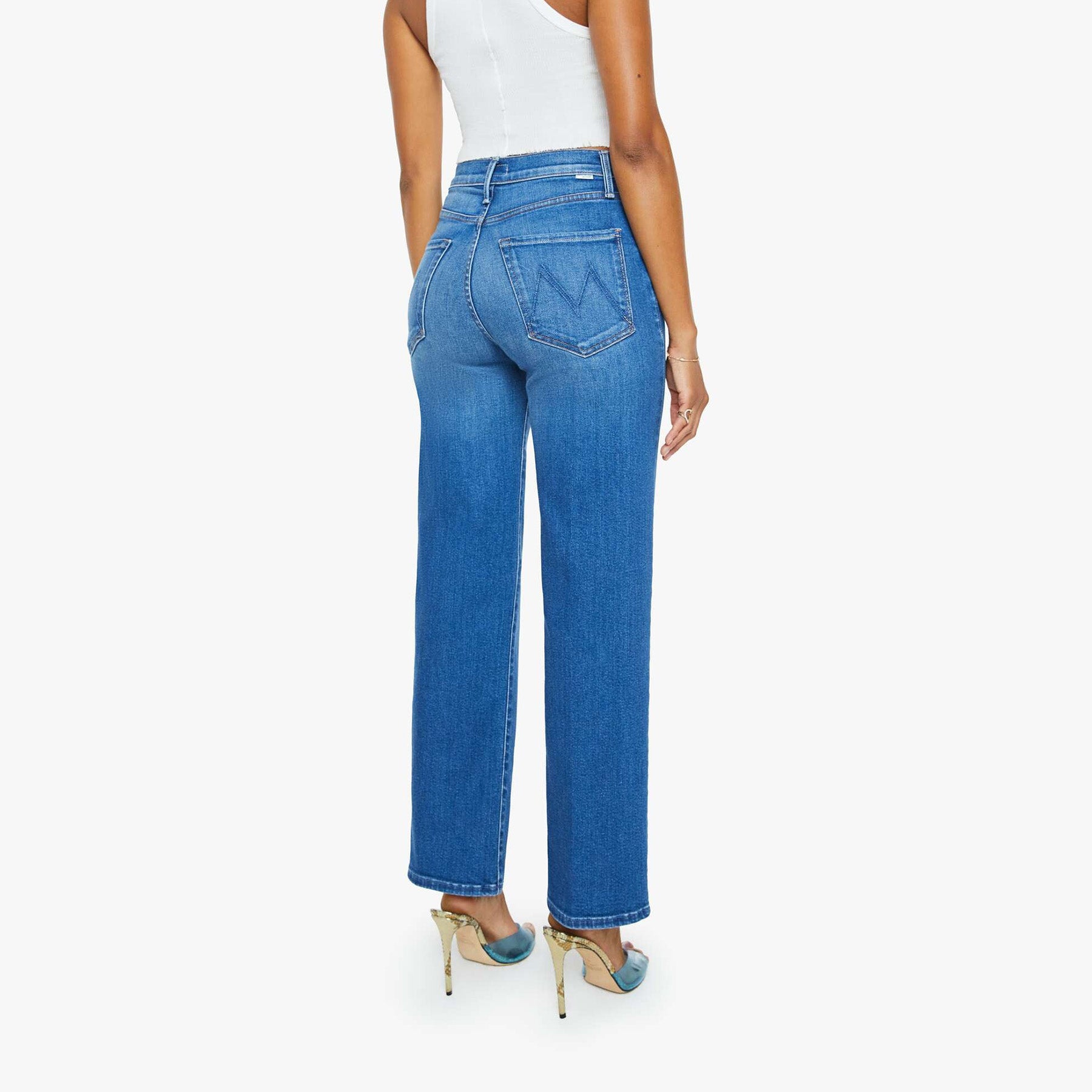 Model showcasing the Rambler Zip Flood jeans, featuring a high-waisted design and straight leg in vintage blue wash.