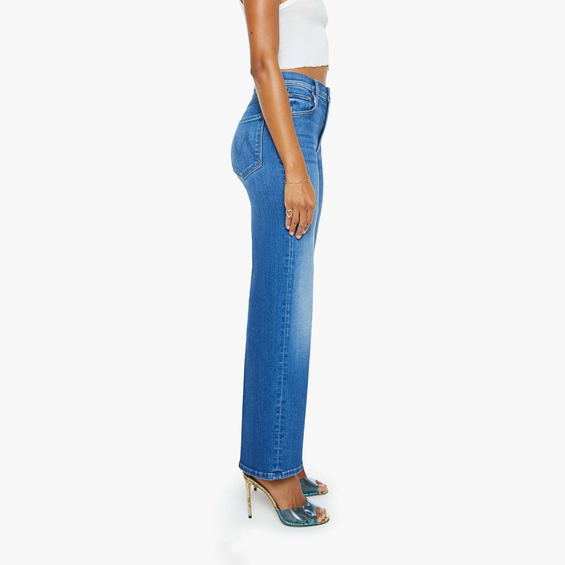Side view of Rambler Zip Flood jeans, high-waisted with a straight leg design, styled with high heels.