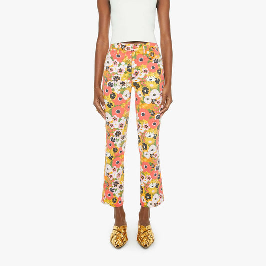 Mid-rise flared jeans in vibrant floral print, model showcasing stylish Al Fresco look, made in Los Angeles.