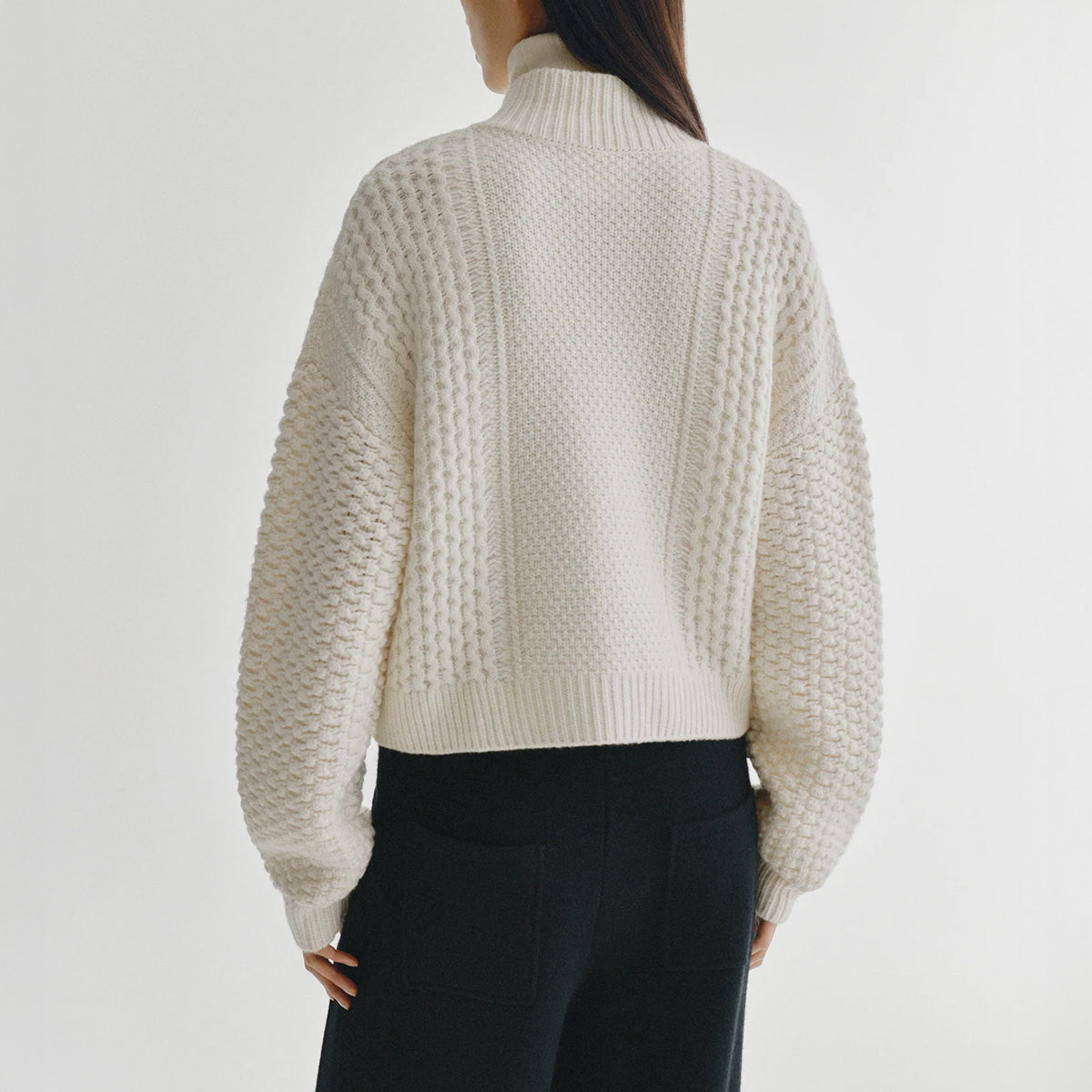 Becs Cardigan in Cream, back view showcasing the cable knit design and relaxed silhouette in heavy knit cashmere.