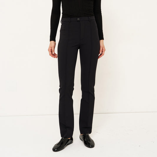 The Riding Pant in Black, slim fit trousers styled like leggings, perfect for versatile dressing.