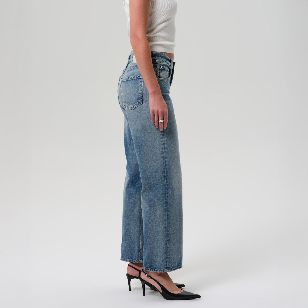 Lindz Low Rise Jean in Bijou, relaxed straight leg style, made from 100% rigid regenerative cotton, model wearing side view.