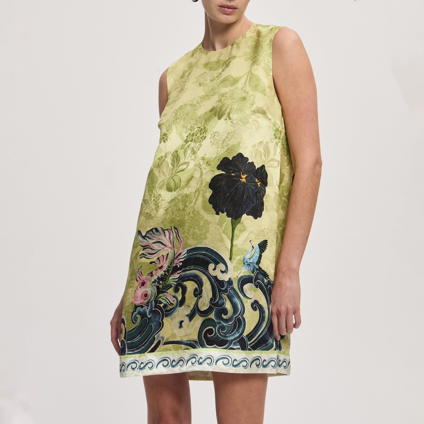Crew neckline with a button closure at the back and a straight silhouette Fabric: 58% viscose, 42% silk Length: 36" . 5410D