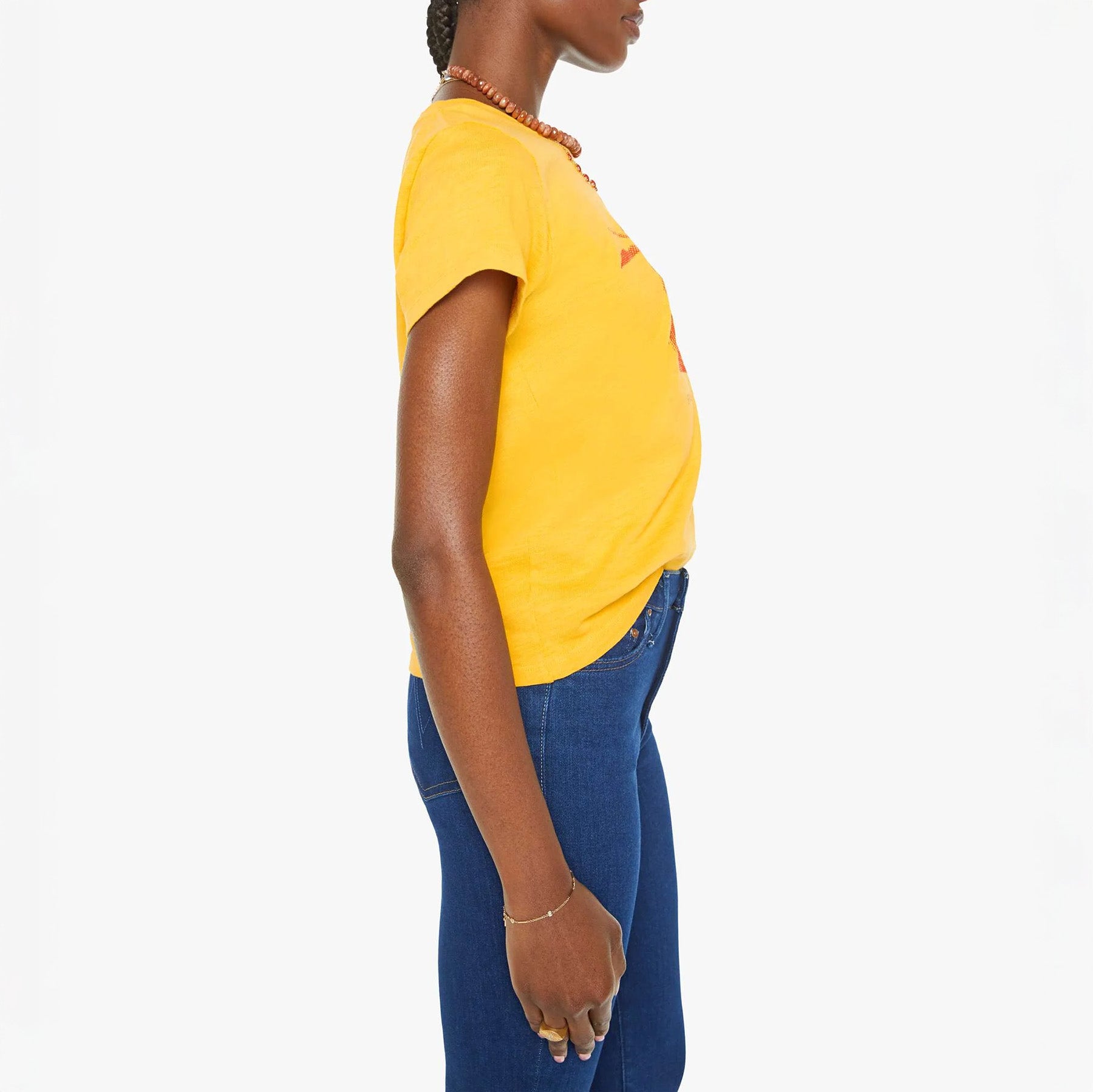 Slim fit crewneck tee shirt featuring a red Pop Art strawberry graphic, styled with blue jeans. Made in Los Angeles.