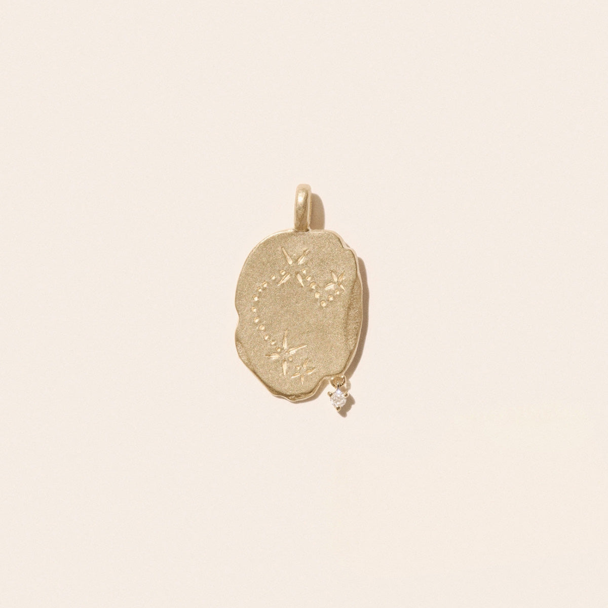 Aries Pendant in 9K Yellow Gold, engraved with constellation and suspended diamond, showcasing its unique design.