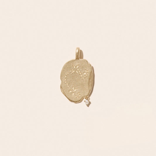 Aries Pendant in 9K Yellow Gold, engraved with constellation and suspended diamond, showcasing its unique design.