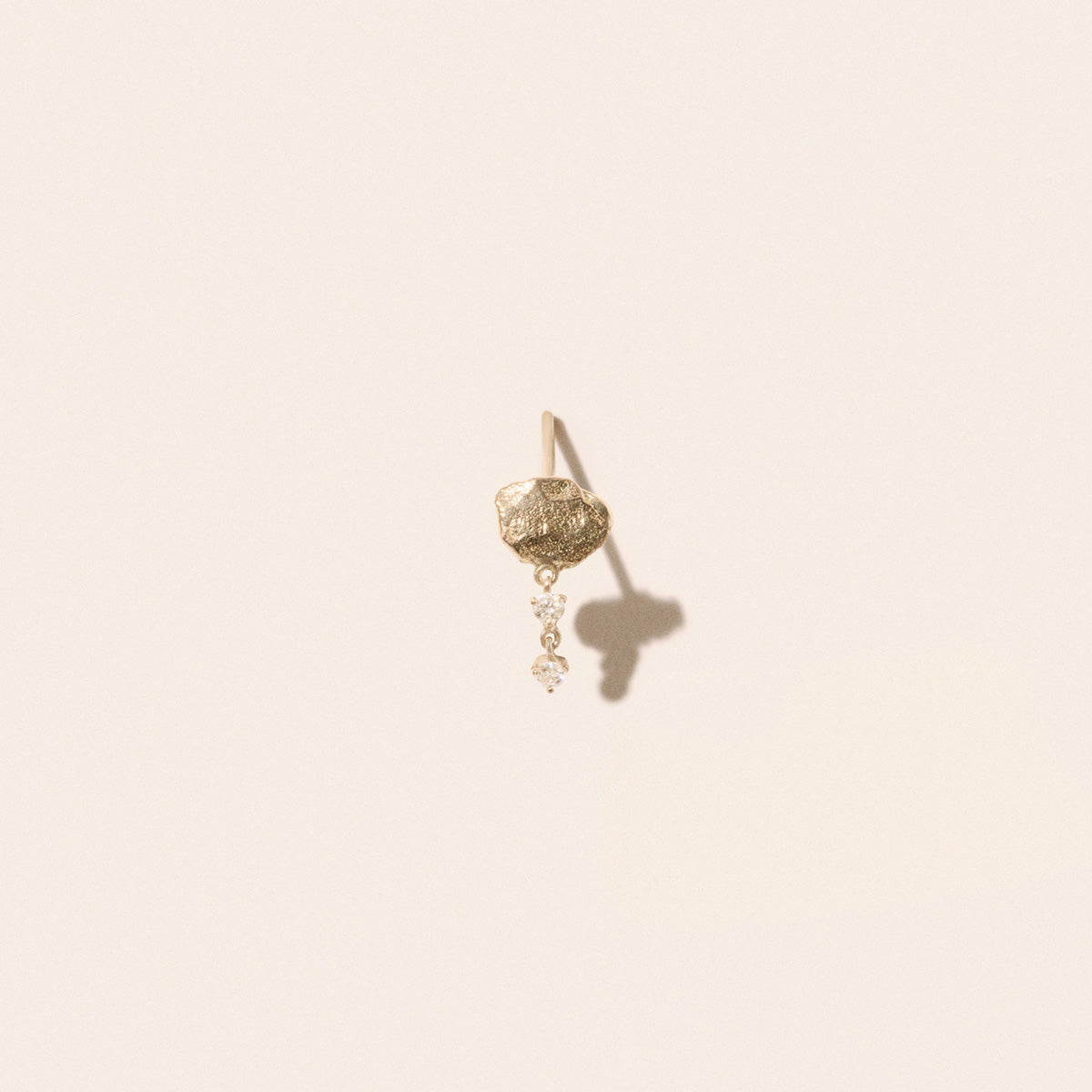 Marla No. 1 Earrings in 9K Yellow Gold with hammered design and suspended diamonds in elegant display.