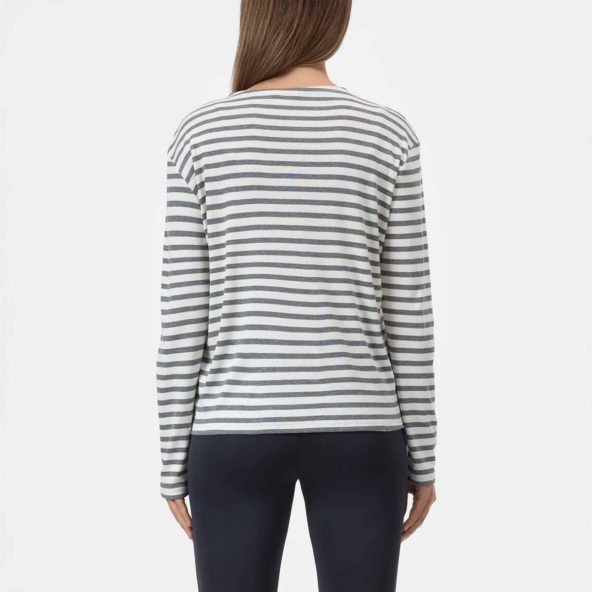 Back view of a model wearing a striped Basic Longsleeve in Cinder Brown with long sleeves.