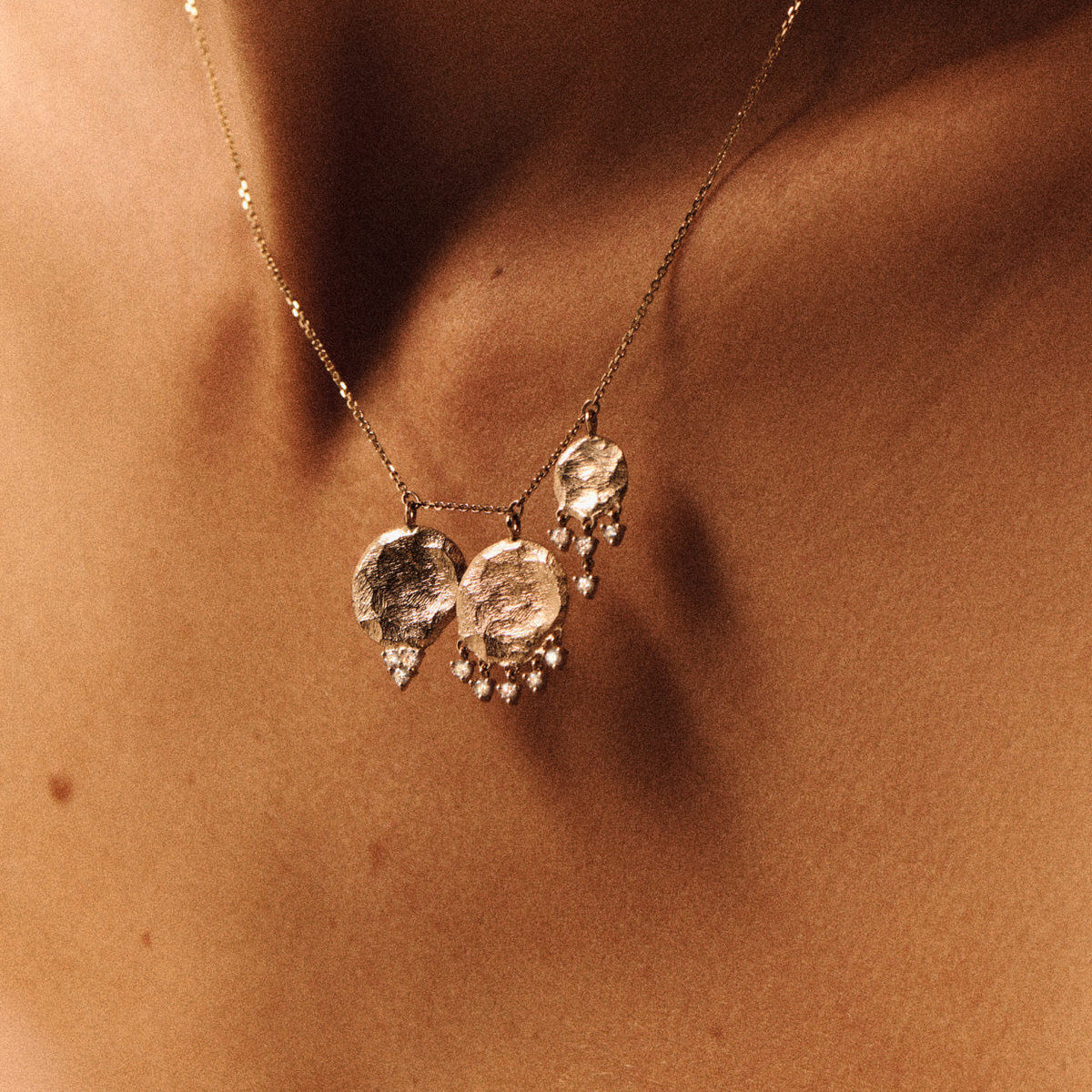 Gaby No.3 Necklace in 9K Yellow Gold featuring textured gold disc pendants and cascading diamonds.