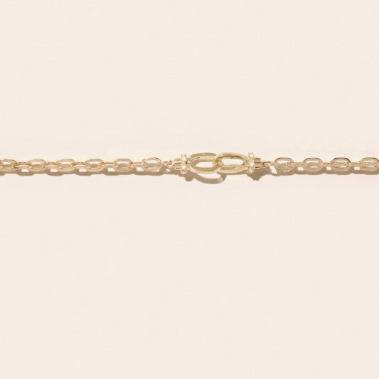 May No. 1 Necklace in 9K Yellow Gold featuring a link chain and interlocking lock clasps.