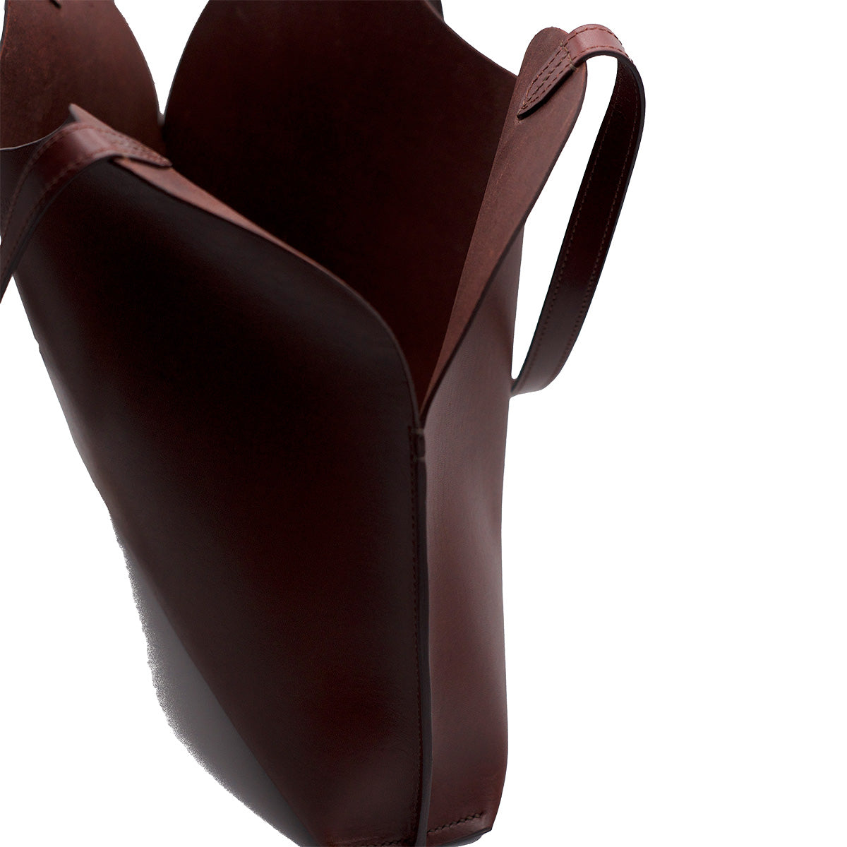 Freja Tote in Oxblood featuring a single compartment, unlined interior, and flat leather straps, handmade in NYC.