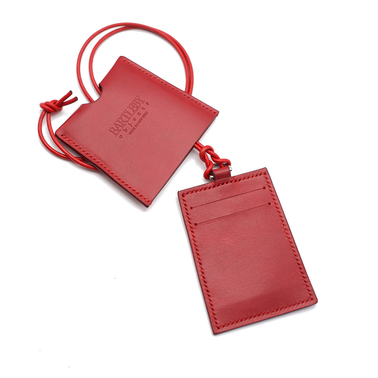 Elegant red card lanyard featuring two slots, handcrafted in NYC with Italian leather, dimensions 4.5" x 3.75".