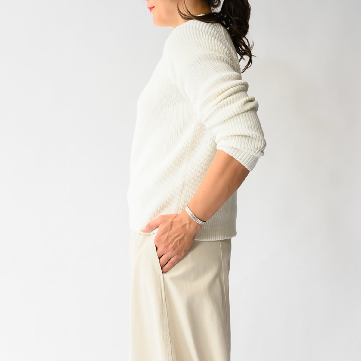 Rib Raglan Crew in Cream worn by model, showcasing ribbed texture and classic fit.
