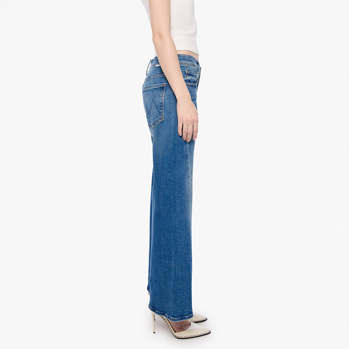 Lil Mid Rise Sidestepper in Strike It Rich shown in side view, featuring relaxed fit straight-leg cut and stylish high heels.
