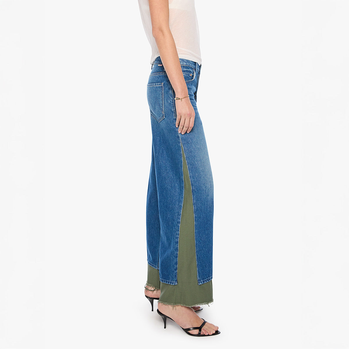 Side view of Nacho Double Dip Nerdy Fray in Refill jeans featuring loose wide leg and frayed hem.