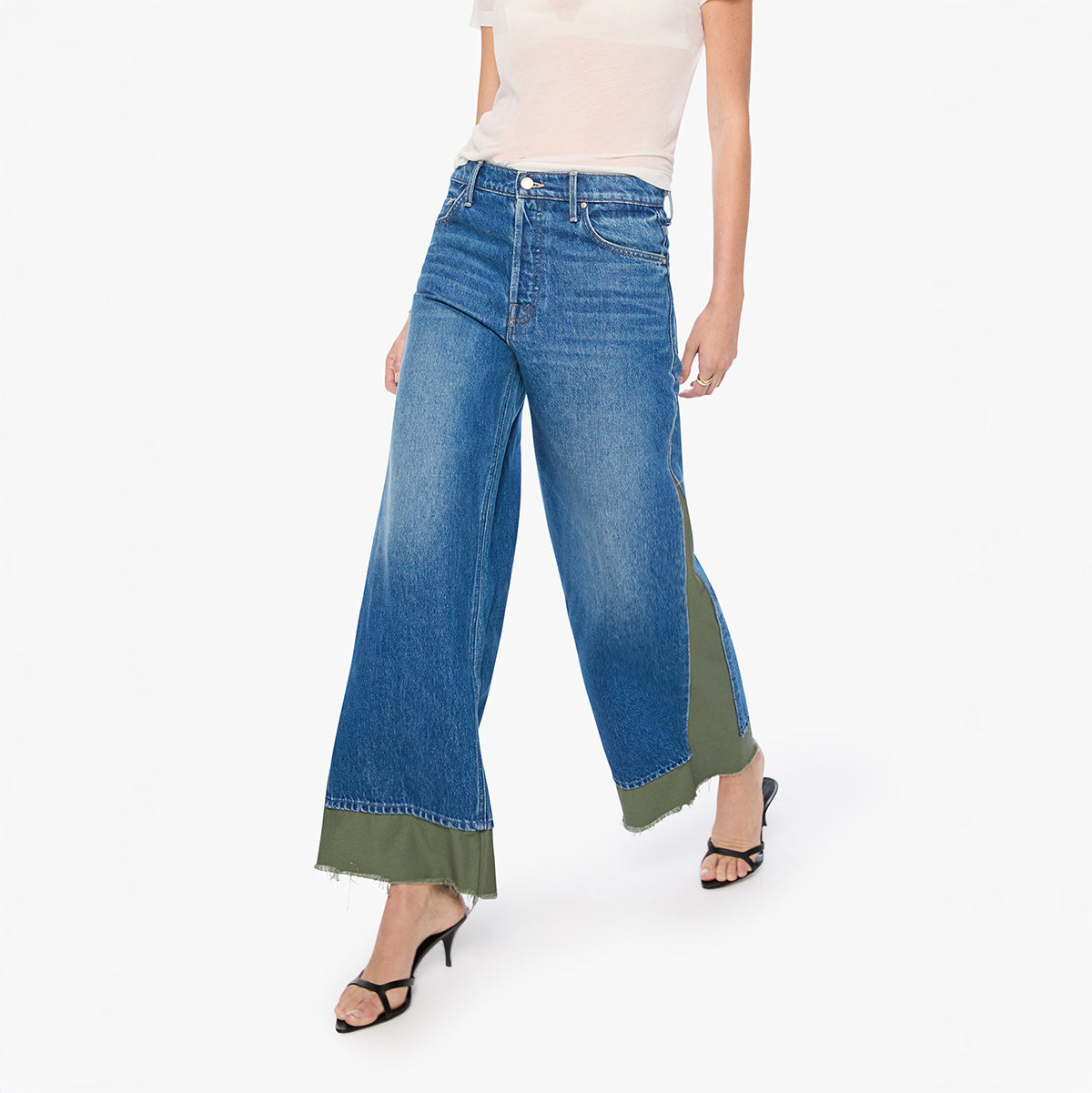 Model walking in high-waisted Nacho Double Dip Nerdy Fray in Refill jeans with frayed hem and loose fit.