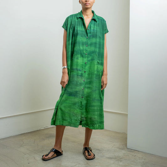 Short-sleeve green rainbow caftan dress with button front and fringed edges, featuring a voluminous, relaxed fit.