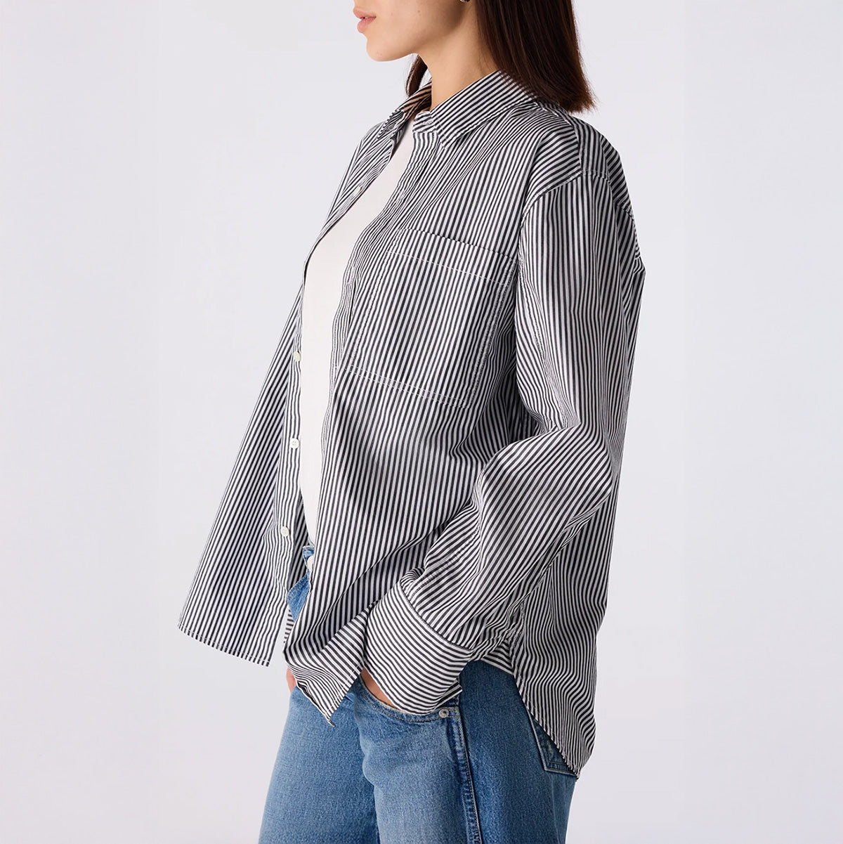 Ruth Oversized Shirt in Black and Eggshell displayed in side view, featuring a striped pattern and single chest pocket.