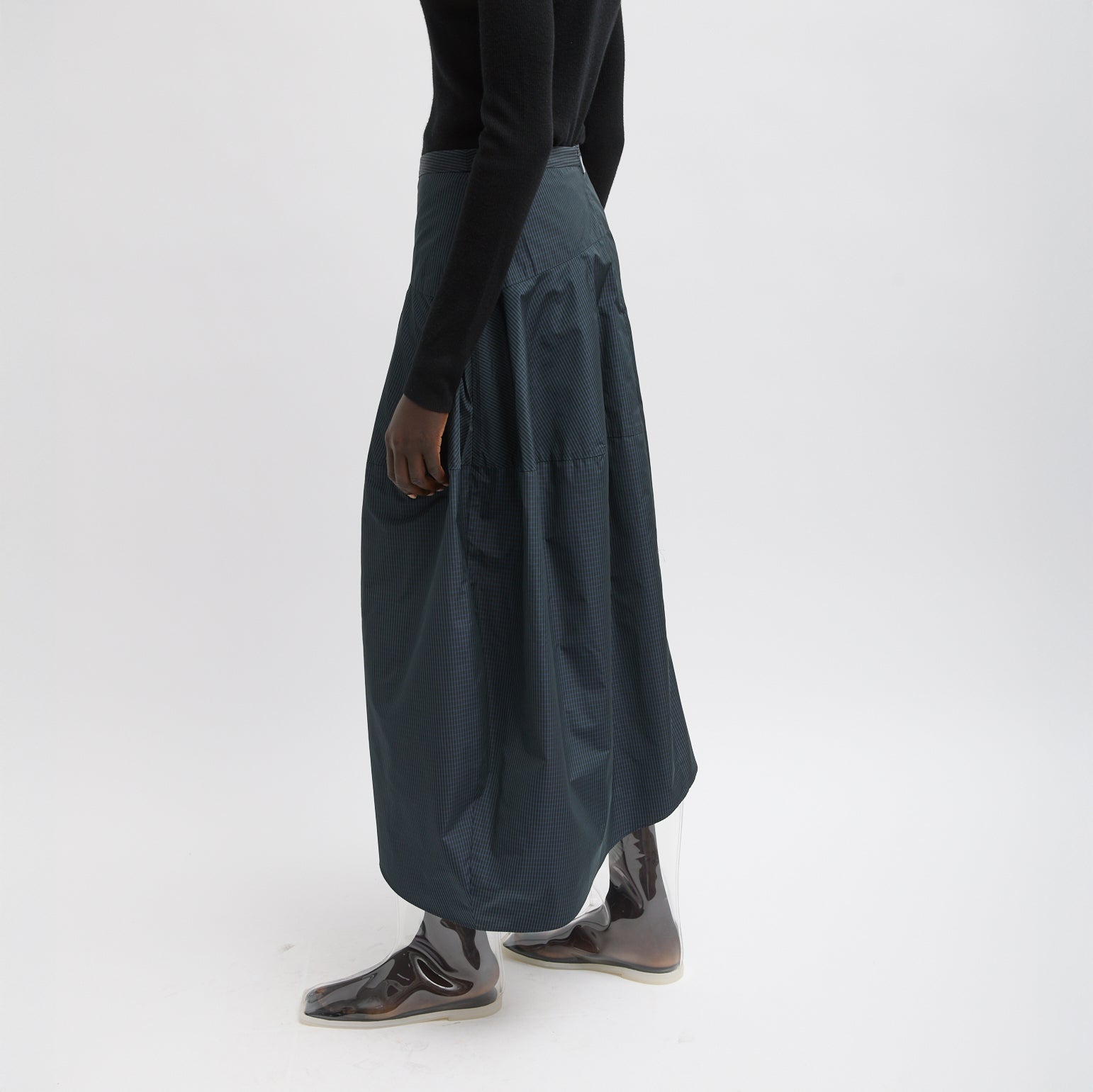 FUNDAMENTAL asymmetrical skirt in a menswear suiting-inspired plaid. Single pocket, mid-rise and invisible side zipper. Japanese compact nylon: 83% polyester, 17% polyamide Length: 31.25" (size 6) Waist: 30.5" (size 6) It is intended to sit just below the