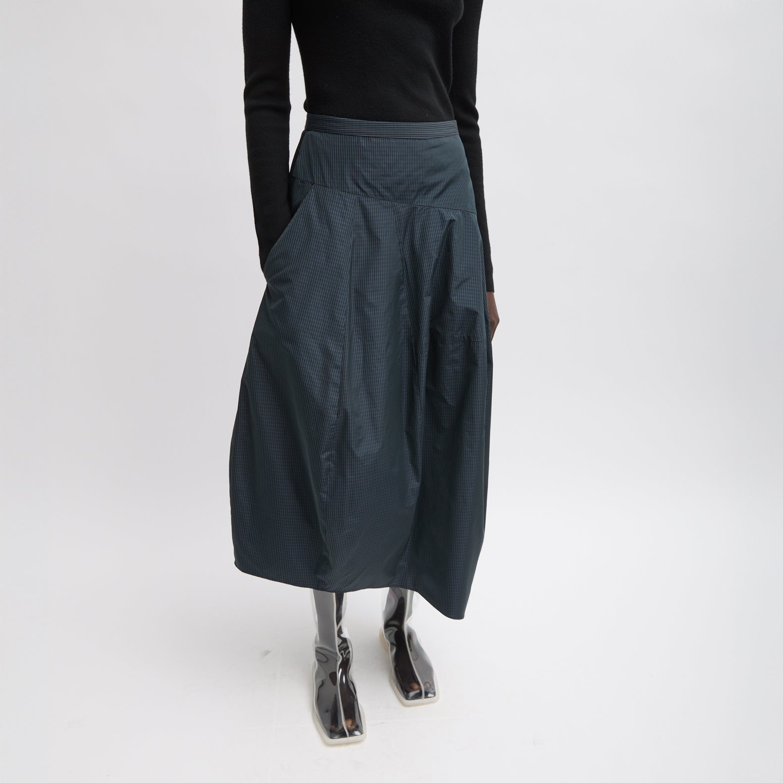 FUNDAMENTAL asymmetrical skirt in a menswear suiting-inspired plaid. Single pocket, mid-rise and invisible side zipper. Japanese compact nylon: 83% polyester, 17% polyamide Length: 31.25" (size 6) Waist: 30.5" (size 6) It is intended to sit just below the
