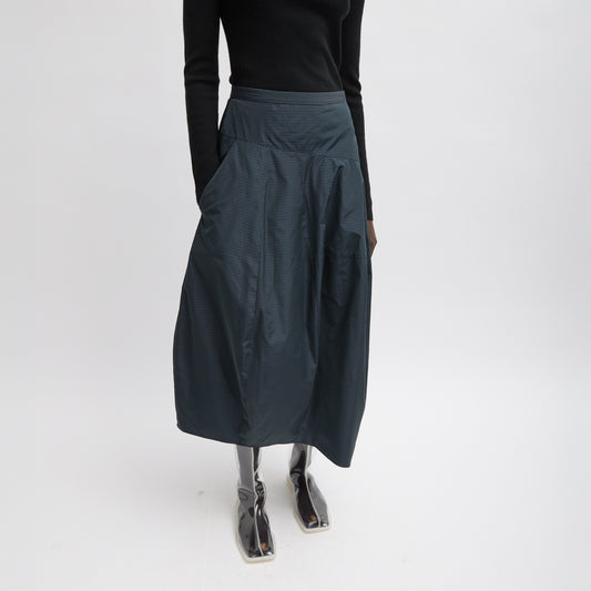 FUNDAMENTAL asymmetrical skirt in a menswear suiting-inspired plaid. Single pocket, mid-rise and invisible side zipper. Japanese compact nylon: 83% polyester, 17% polyamide Length: 31.25" (size 6) Waist: 30.5" (size 6) It is intended to sit just below the