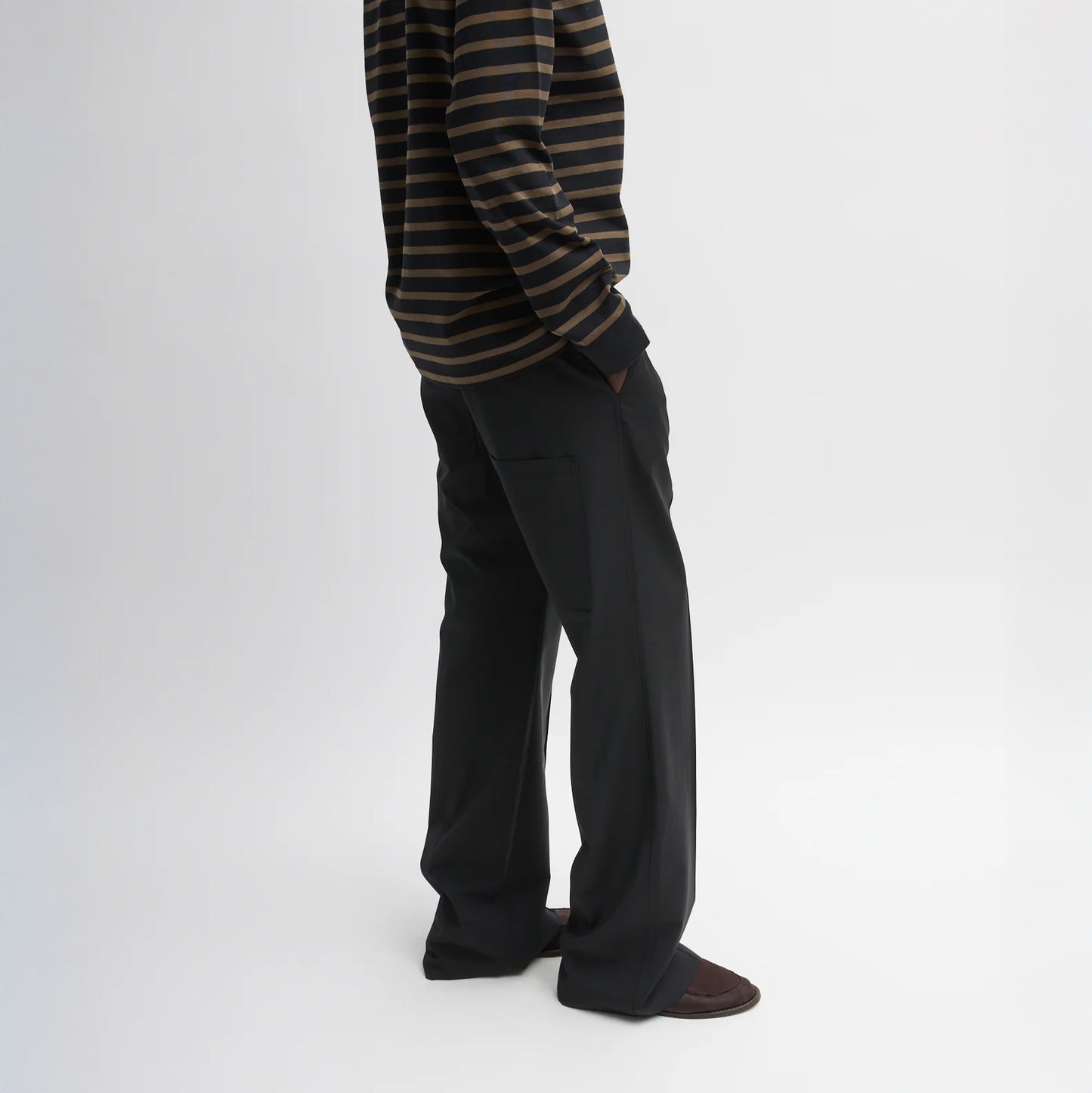 Pull on pant with an elastic waistband, drawstrings, belt loops and hidden snap at hem Tropical Wool fabric: 53% polyester, 43% wool, 4% elastane T000TW312