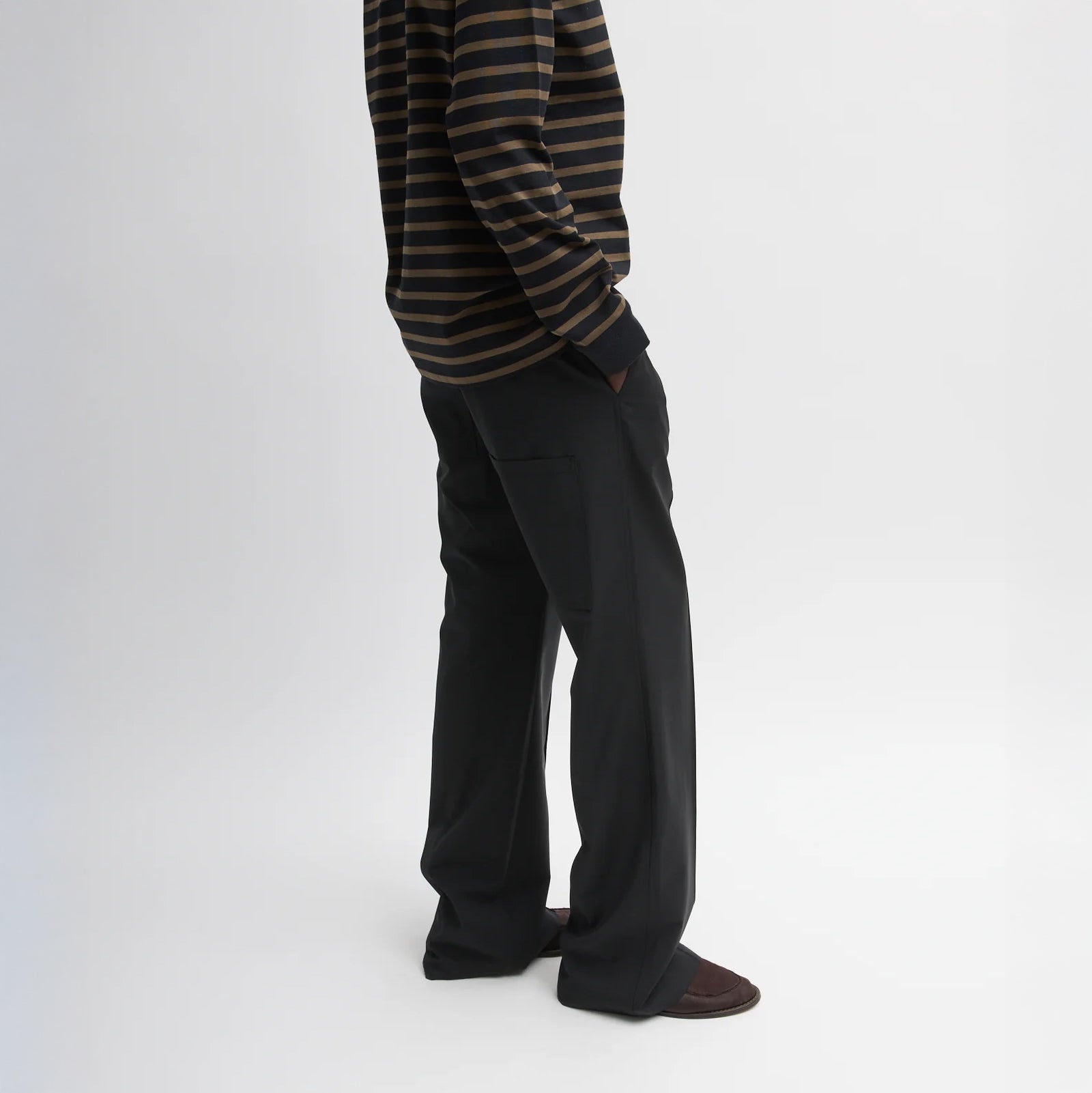 Pull on pant with an elastic waistband, drawstrings, belt loops and hidden snap at hem Tropical Wool fabric: 53% polyester, 43% wool, 4% elastane T000TW312