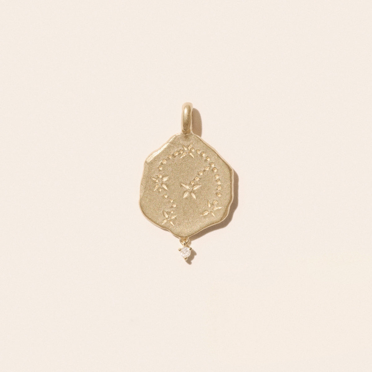 Aquarius Pendant in 9K Yellow Gold featuring an engraved constellation and a suspended diamond.