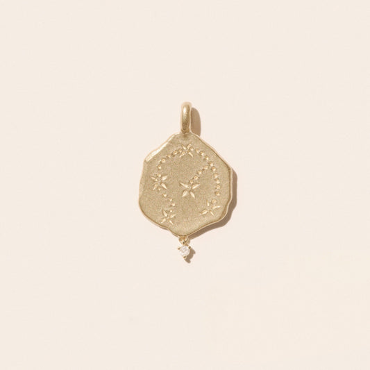Aquarius Pendant in 9K Yellow Gold featuring an engraved constellation and a suspended diamond.