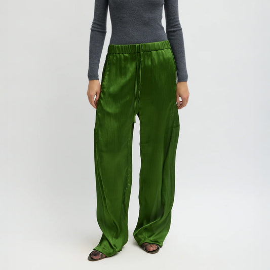 Matte Satin Plissé Winslow Pant in Green displayed on a model, featuring a relaxed fit and elastic waistband.