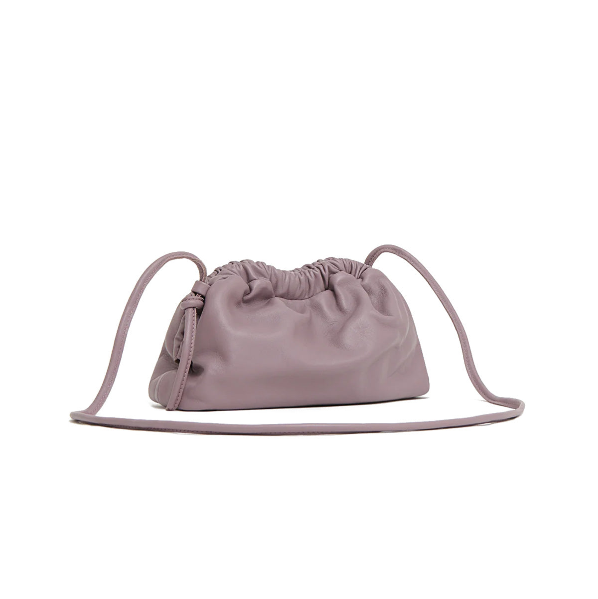 Mini Cloud Clutch in Uva made of soft lamb leather with a sculptural design and removable strap.