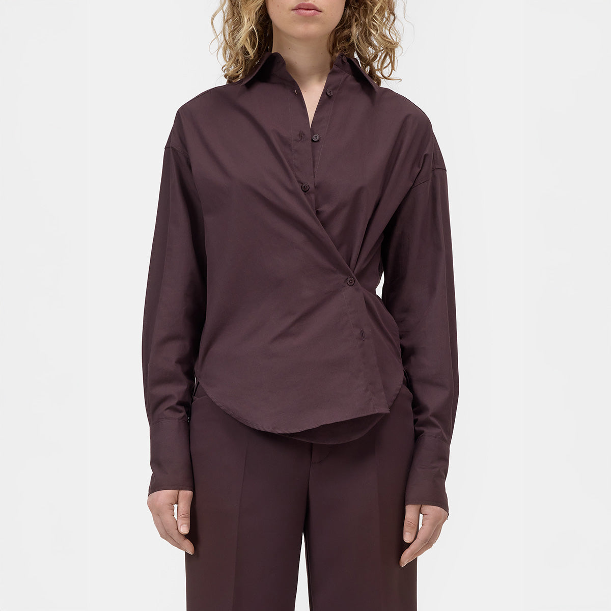Wrap Shirt in Cinder Brown displayed front view featuring asymmetrical wrap detail and rounded hem.