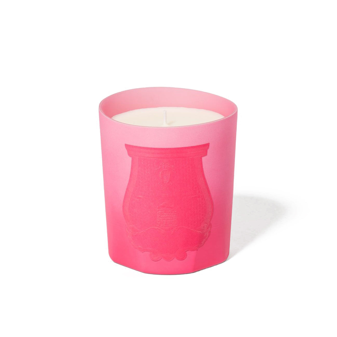 Summer Haze rose cake candle in a pink glass container, exuding a sweet-floral aroma from Trudon's summer collection.